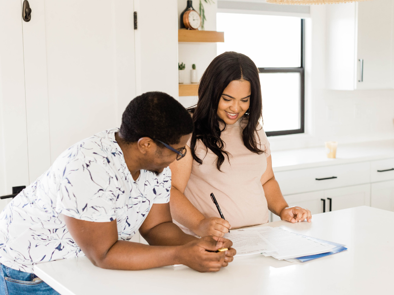 Couple signing a lease.