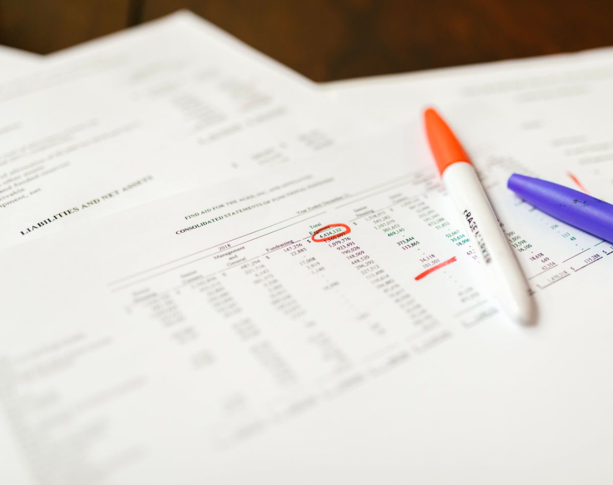 Millington lease renewal strategy documents with highlighted notes, charts, and pens on a desk, showing analysis for Millington property lease renewal planning.