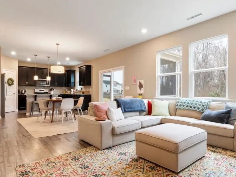 Olive Branch rental with LVP flooring, updated lighting, and staged living area