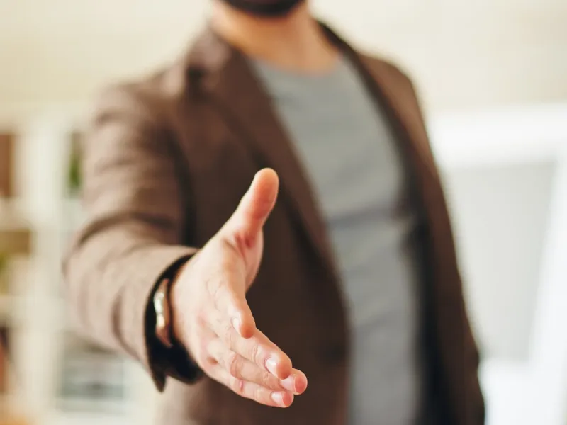 Man offering a handshake.