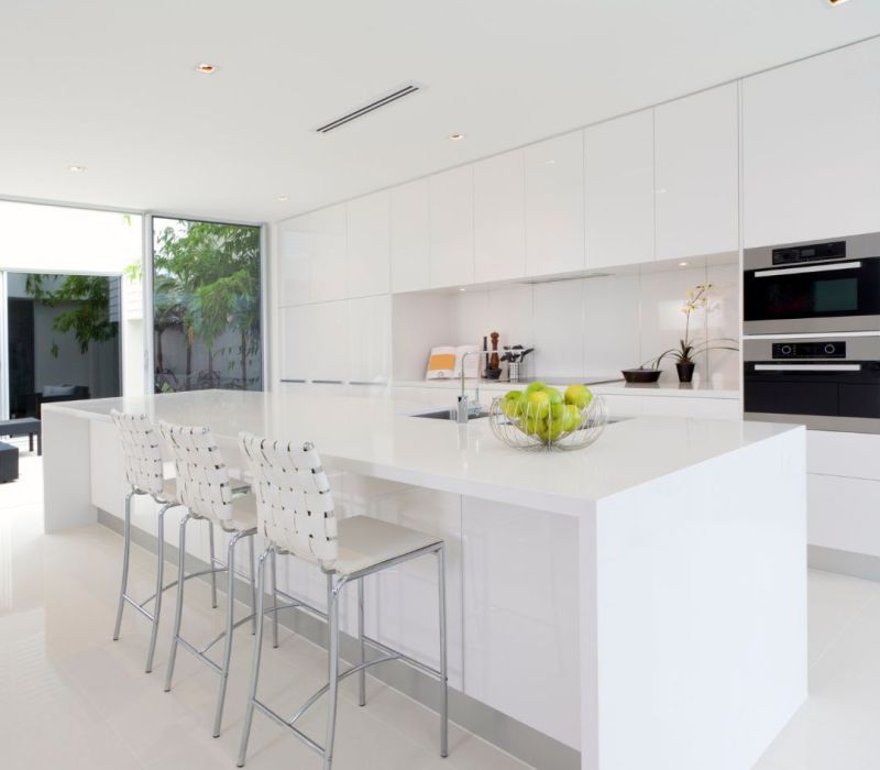 Bright renovated rental kitchen with white cabinets, large island, and modern appliances in Horn Lake MS.