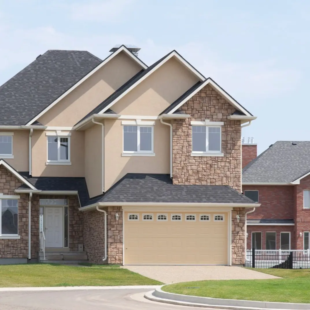 Two-story suburban brick home with a two-car garage and front lawn, Self-Managing Rental Property in Collierville