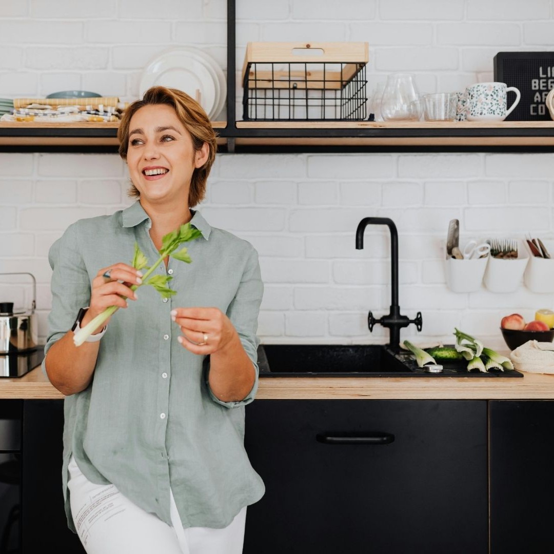 Smiling tenant in a kitchen, representing Section 8 rental property management in Nesbit, MS