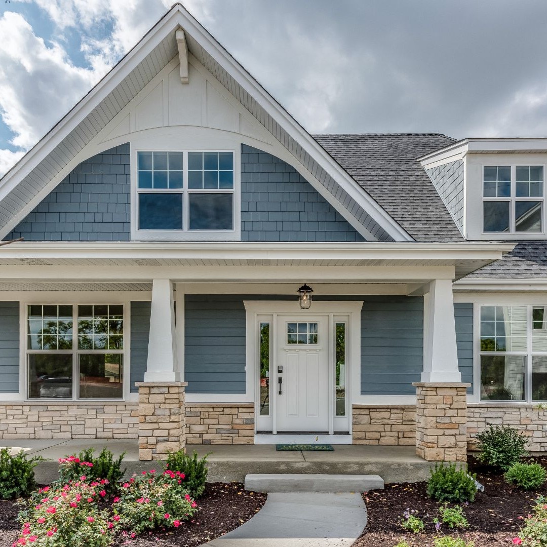 Renovated rental home exterior with updated siding, windows, and entryway in Germantown, TN.