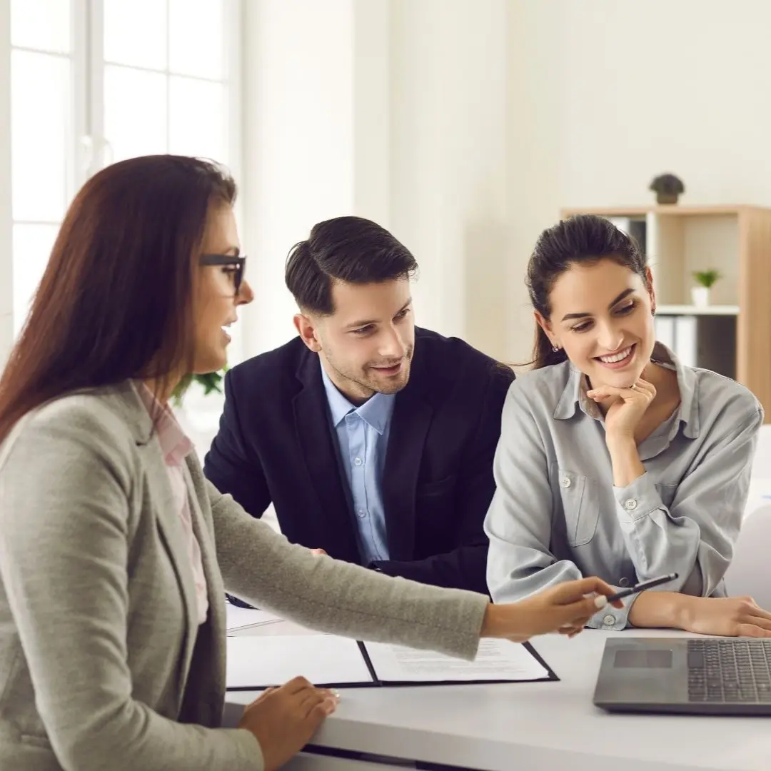 Memphis Section 8 rent reasonableness discussion with a property owner reviewing paperwork with two professionals at a desk