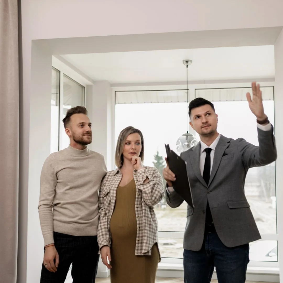 Real estate agent walking buyers through a home during BRRRR acquisition support in Arlington, TN