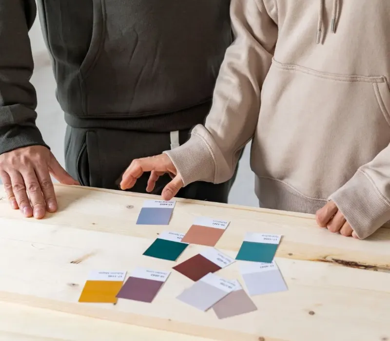 Property management renovation planning in Byhalia, MS with team reviewing paint color samples and finish options for a rental upgrade.