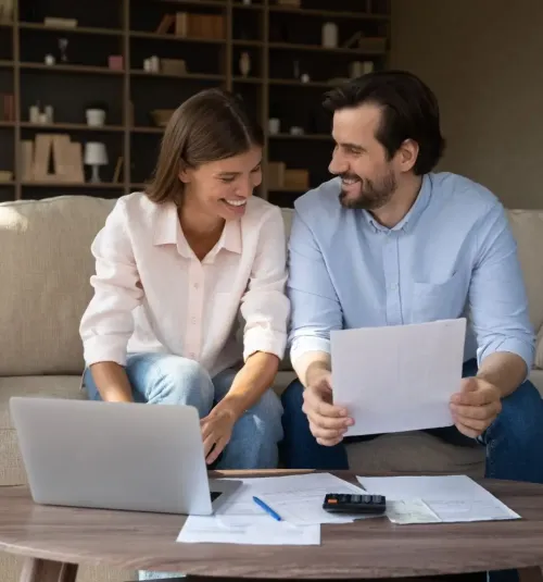 Nesbit MS rental property owners reviewing renovation budget and documents on a laptop.