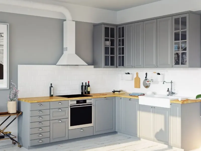 Updated rental kitchen with gray cabinets, white tile backsplash, and new countertops in Germantown, TN.