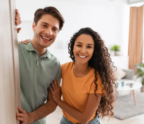 Two people looking out an open door. - Property Management in Collierville, TN
