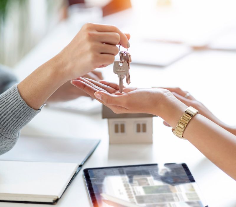 Handing over the. keys to a property.