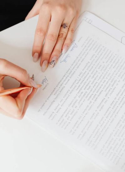 A person signing a contract - property management in Arlington TN